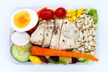 Salad with meat and vegetables in plastic package box
