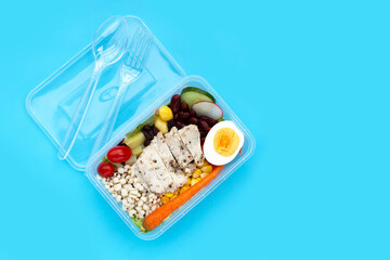 Salad with meat and vegetables in plastic package box