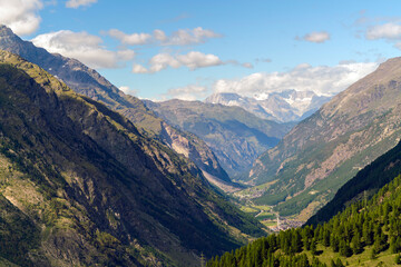 Fototapeta na wymiar Valley in the alps surrounded by mountains in summer near Zermatt in Switzerland
