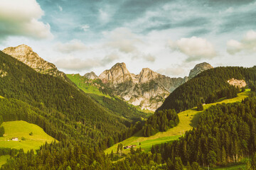 landscape with mountains and clouds in the heart of the Alps in Switzerland in summer
