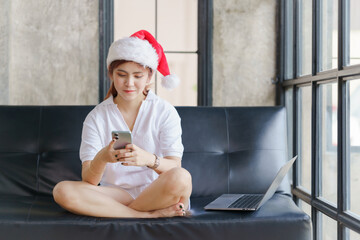 Asian woman relax on sofa in holiday.