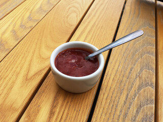 Tomato Mexican barbecue sauce, ketchup in a bowl with a spoon