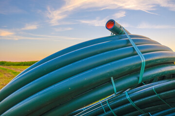 Plumbing equipment. Pipe laying.Plumbing plastic pipes in rolls . Bringing water to the house....