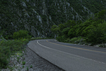 Fototapeta na wymiar Beautiful view of empty asphalt highway near mountains outdoors. Road trip
