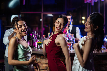 Asian beautiful woman having fun, dancing with music in bar restaurant. 
