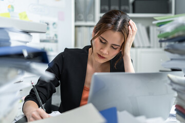 Asian beautiful businesswoman thinking of problem solution in office. 