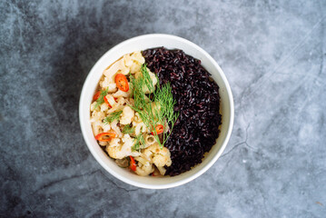 Spicy fish with black rice in