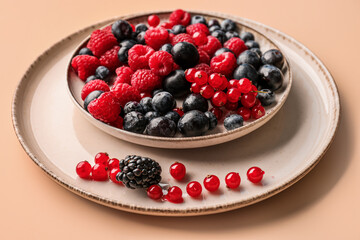 Plate with fresh berries on color background, closeup