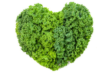 heart shape by curly kale leaves. healthy vegetable and food dieting concept.