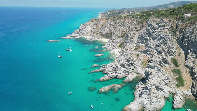 Capo Vaticano Cliff, Sandy Beaches, Blue Mediterranean Sea and Coastline of Calabria, South Italy - Aerial 4k Tilting Down