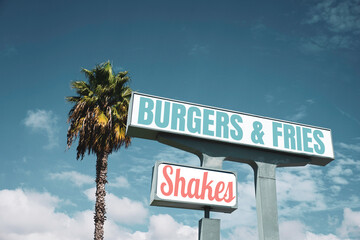 Retro vintage burgers and fries sign with palm tree