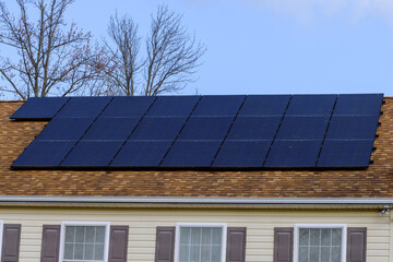 Naklejka premium solar panels installed on the roof of the house