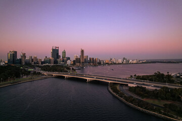 Fototapeta na wymiar Aerial view of the Narrows bridge across the Swan River and the Perth skyline at sunset.