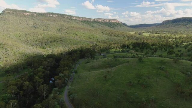 Green Hills With Sky Road With Creek, Aerial