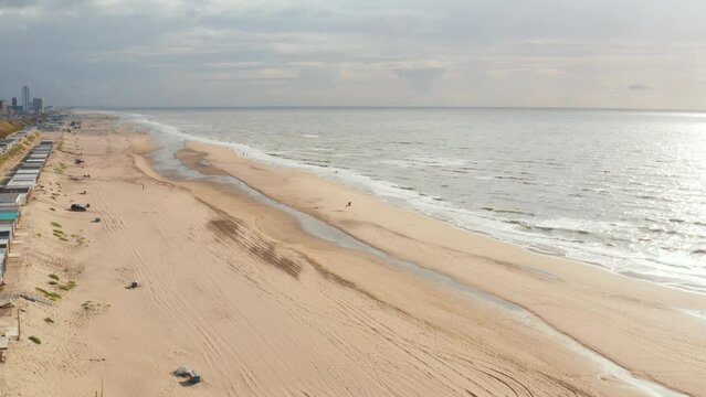 Slow panning drone shot of the beach in Zandvoort Netherlands