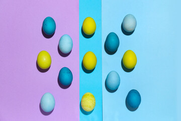 Composition with Easter eggs on color background