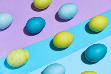 Composition with Easter eggs on color background