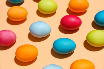 Many colorful Easter eggs on color background