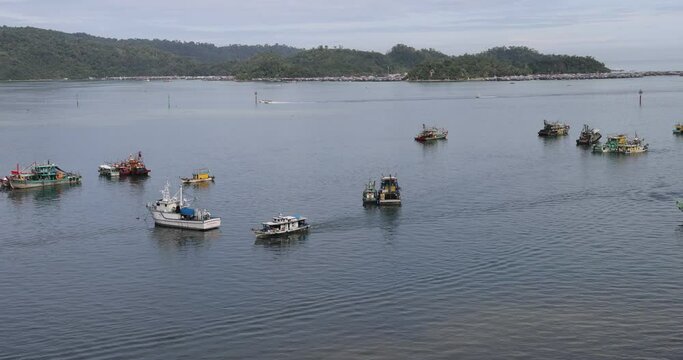 ships boats fishing trollers on ocean sea water of south China sea bay kota Kinabalu sabah
