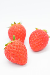 beautiful three fresh red strawberry isolated on white background