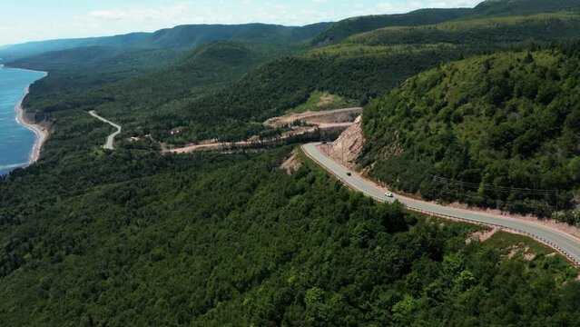 Cars driving on the coastline of the Cabot Trail, Nova Scotia