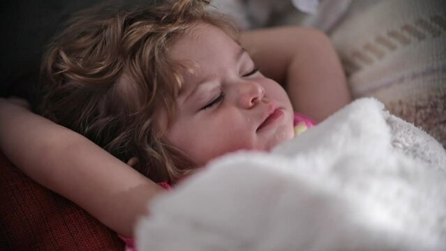 Beautiful little girl moving eyes while sleeping 