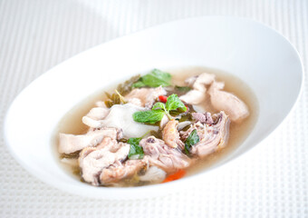 Tom Yum Chicken with Mushroom Straw on a White Bowl - selective focus