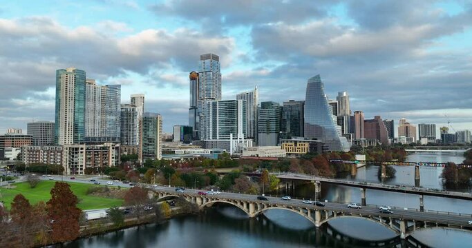 Truck shot of downtown Austin skyline over the Colorado River infront of the Lamar Blvd Bridge