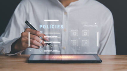 Businessman checking the steps through a virtual online document with a list of checkboxes Concepts of practices and policies, company articles of association Terms and Conditions,Privacy Policy