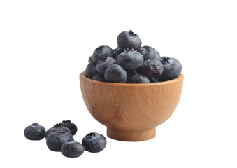 Blueberries in a wooden cup on a white background
