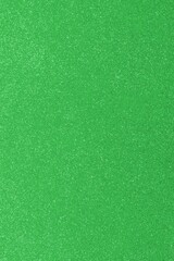 GREEN glitter material background with glowing effects and reflections