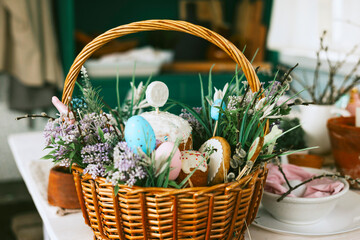 Fototapeta na wymiar basket for Easter party, setting for celebration of Happy Easter in country house, spring, rustic style