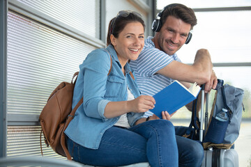 couple traveler waiting for tram on stop