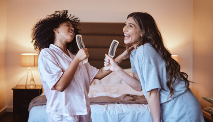 Friends, singing with brush and women in bedroom to get ready for girls night out dancing, fun...