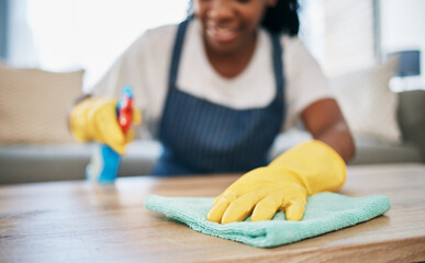 Hand, cloth and gloves with a black woman cleaning a home for hygiene as a housekeeper or maid....