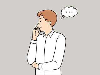 Man thinks about ways to solve problem that has arisen and touching chin looks to side