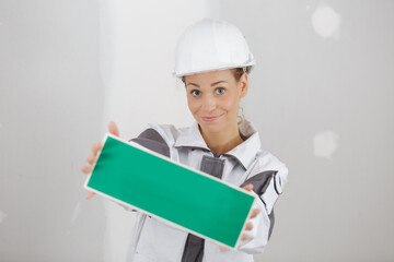 young woman holding a fresh paint symbol