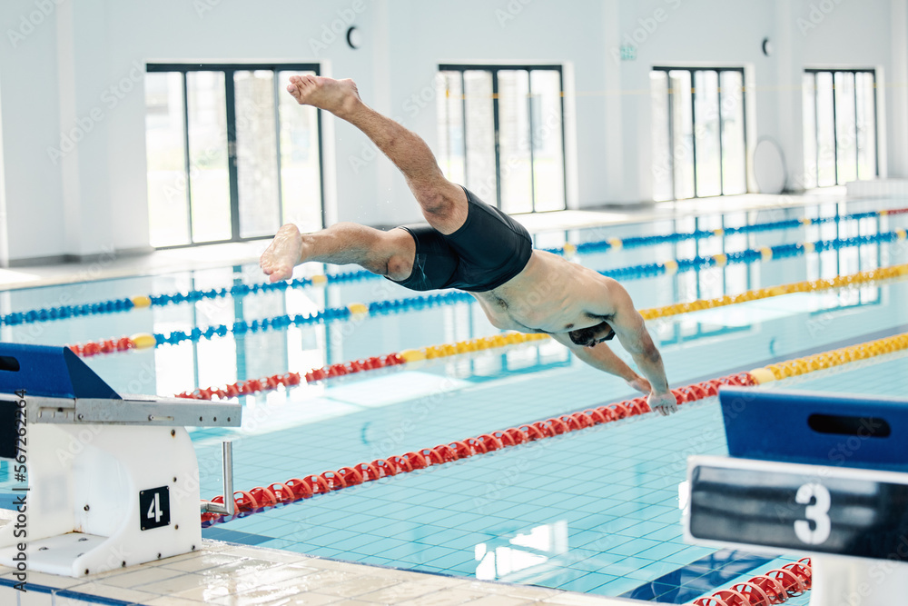 Sticker Sports, swimming pool and man diving in water for training, exercise and workout for competition. Fitness, wellness and professional male athlete in action for dive, jump and race from diving board