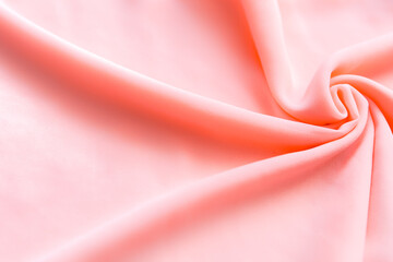Light pastel pink folded fabric as a background