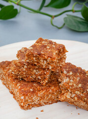 old fashioned granola oat squares on light wood