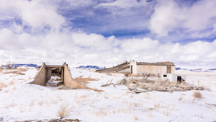 Exterior entrance to deserted adobe Potato Bunker, San Luis Valley, Colorado, showing bunker and...