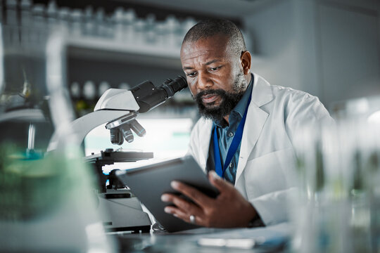 Black man thinking, science and tablet for online research, laboratory and healthcare sample. African American male, scientist or research in lab, digital data and update experiment results and focus