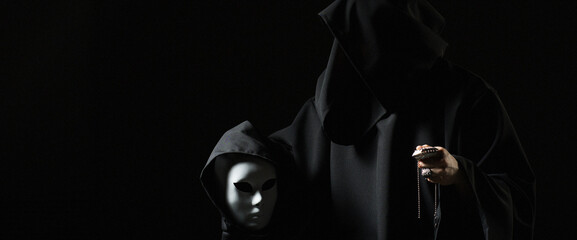 Rite of deal with devil. Sinner in black clothes and demon in sleeve. Man possessed by devil. Evil...