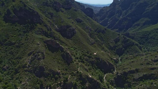 Canyon and mountain ravines with Mediterranean forest and river bed. Aerial view from drone. R&iacute;o Verde. Granada. Spain.