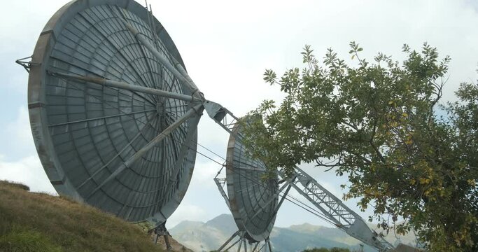Radio transmissions. Parabolic antennas of an abandoned military base.Large dishes placed on a mountain, used in the past for radio transmissions. 