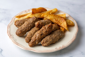 Traditional Turkish food; dry meatballs or inegöl meatballs with potatoes (Turkish name; Kuru kofte or anne koftesi)