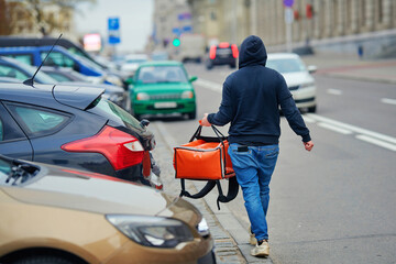 Food delivery service, man with red thermal backpack delivering food orders, food deliver....