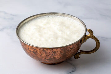 Ayran - Traditional Turkish yoghurt drink in a copper cup