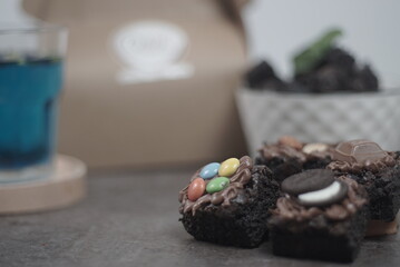 Brownies cake with topping candy and a cup of butterfly pea tea