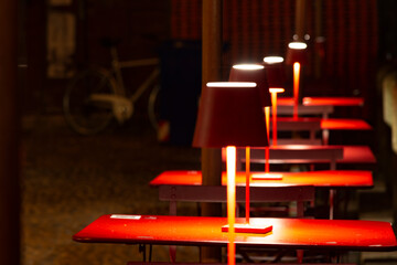 Table lamps during aperitif time in Treviso, Italy